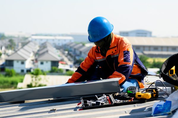 Maintenance worker with safety helmet working at solar power station, Renewable energy, Green energy from nature, Eco technology for electric power